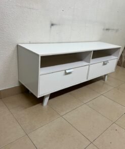 A modern, white, freestanding TV stand featuring angled legs and two large lower storage drawers, topped by open shelves. - Image 4