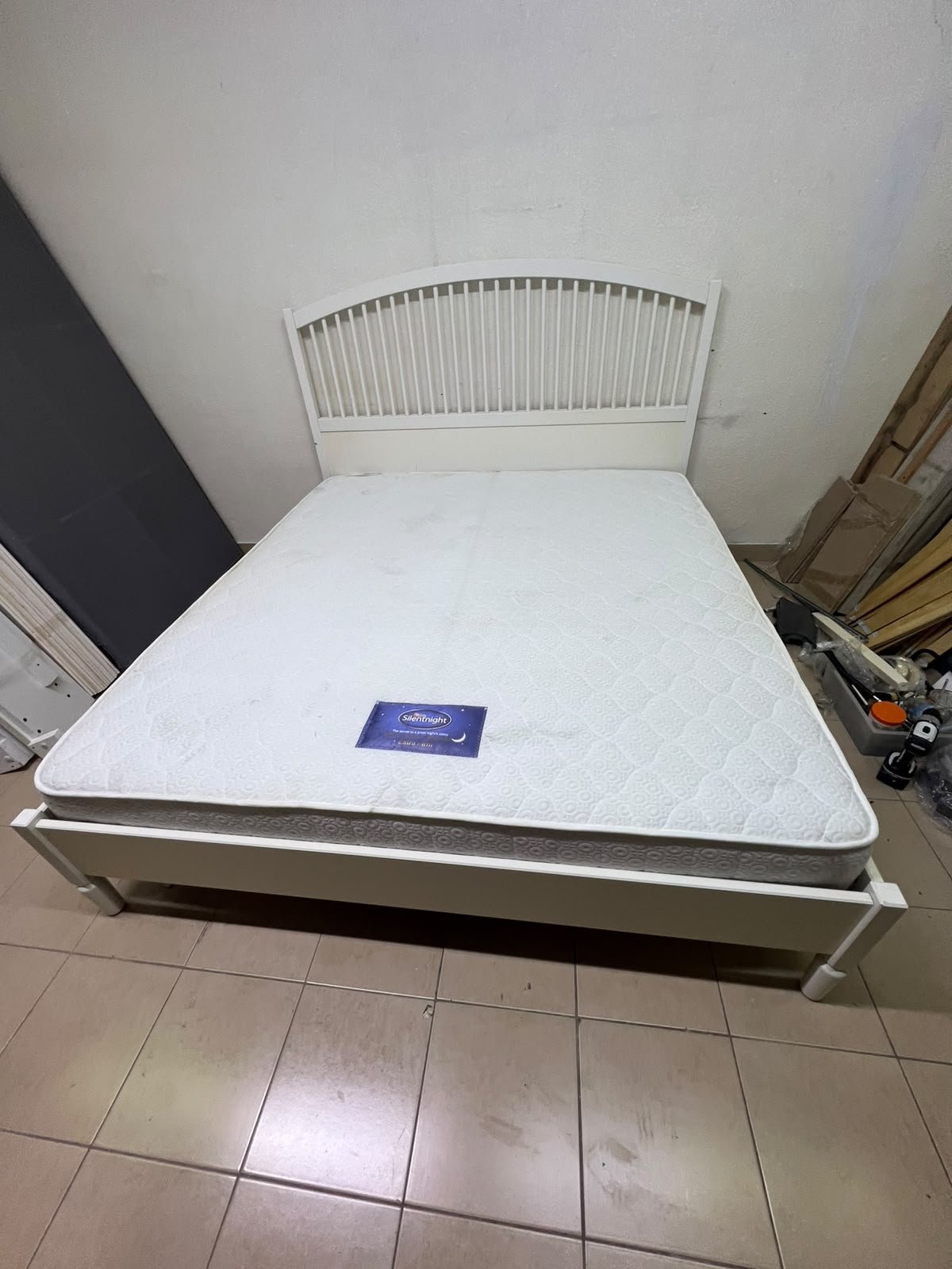 The white IKEA TYSSEDAL bed frame, featuring distinctive vertical wooden slats on the arched headboard and carved legs. - Image 10