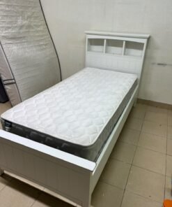A white wooden single bed frame featuring a headboard with built-in bookshelves, and equipped with a standard padded mattress. - Image 13