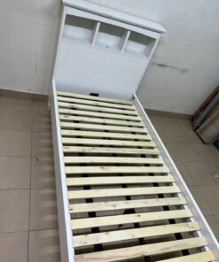 A white wooden single bed frame featuring a headboard with built-in bookshelves, and equipped with a standard padded mattress. - Image 7