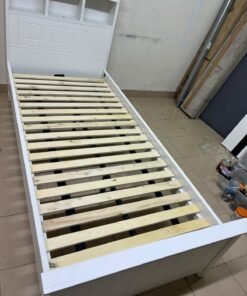 A white wooden single bed frame featuring a headboard with built-in bookshelves, and equipped with a standard padded mattress. - Image 5