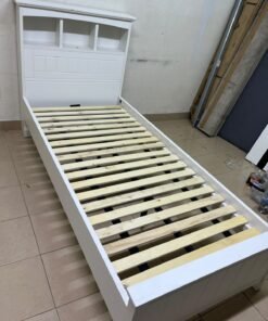 A white wooden single bed frame featuring a headboard with built-in bookshelves, and equipped with a standard padded mattress. - Image 14