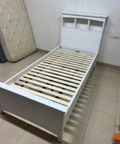 A white wooden single bed frame featuring a headboard with built-in bookshelves, and equipped with a standard padded mattress. - Image 15
