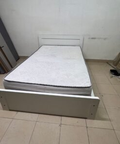 The image shows a white wooden bed frame with a matching headboard and a patterned mattress. - Image 6