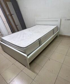 The image shows a white wooden bed frame with a matching headboard and a patterned mattress. - Image 3