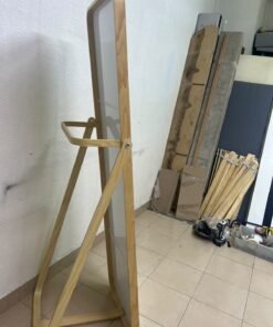 The IKEA IKORNNES ash wood standing mirror, featuring a distinctive rounded wooden frame and a hanging rail integrated into the rear stand. - Image 2