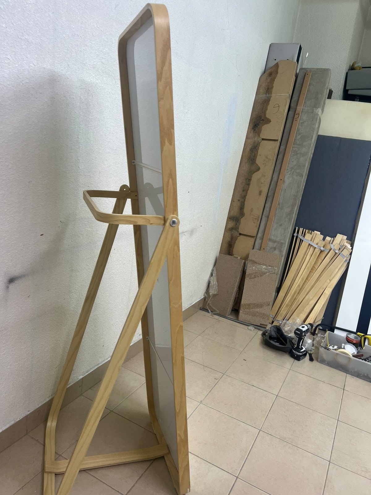 The IKEA IKORNNES ash wood standing mirror, featuring a distinctive rounded wooden frame and a hanging rail integrated into the rear stand. - Image 2