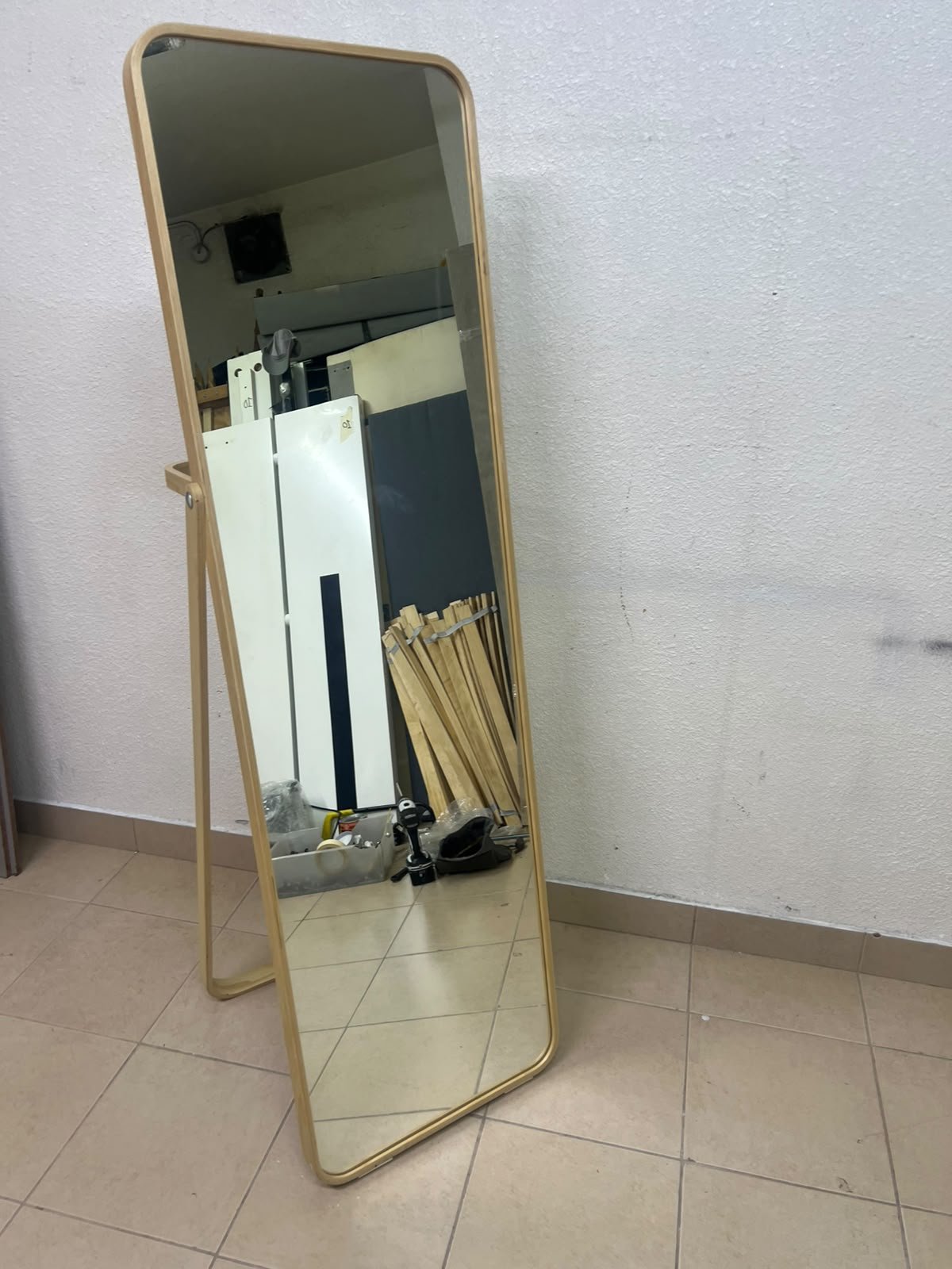 The IKEA IKORNNES ash wood standing mirror, featuring a distinctive rounded wooden frame and a hanging rail integrated into the rear stand. - Image 3