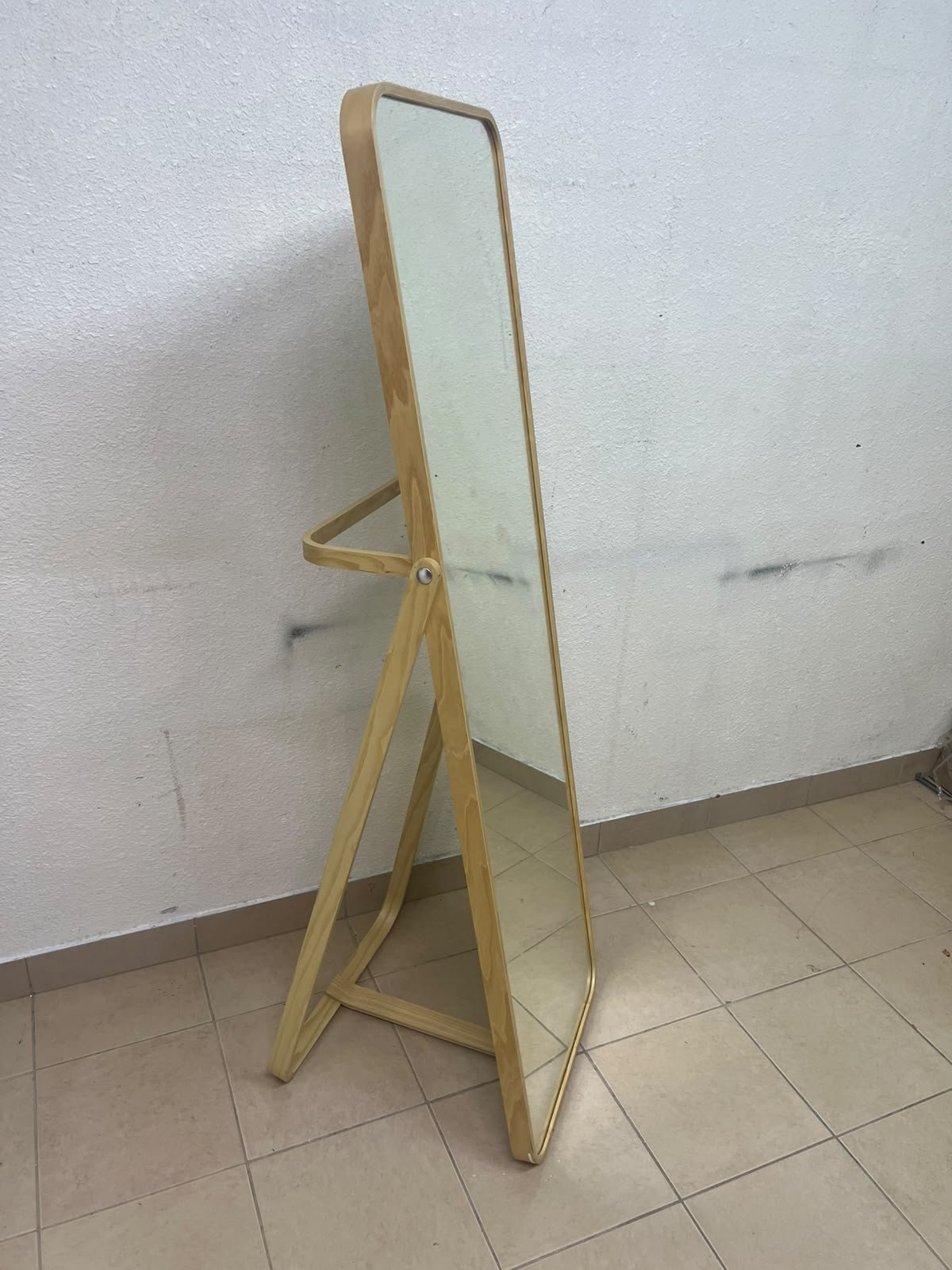 The IKEA IKORNNES ash wood standing mirror, featuring a distinctive rounded wooden frame and a hanging rail integrated into the rear stand. - Image 4