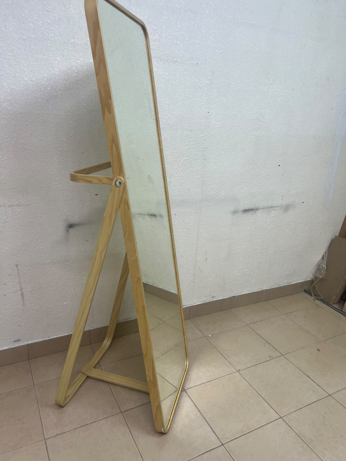 The IKEA IKORNNES ash wood standing mirror, featuring a distinctive rounded wooden frame and a hanging rail integrated into the rear stand. - Image 6