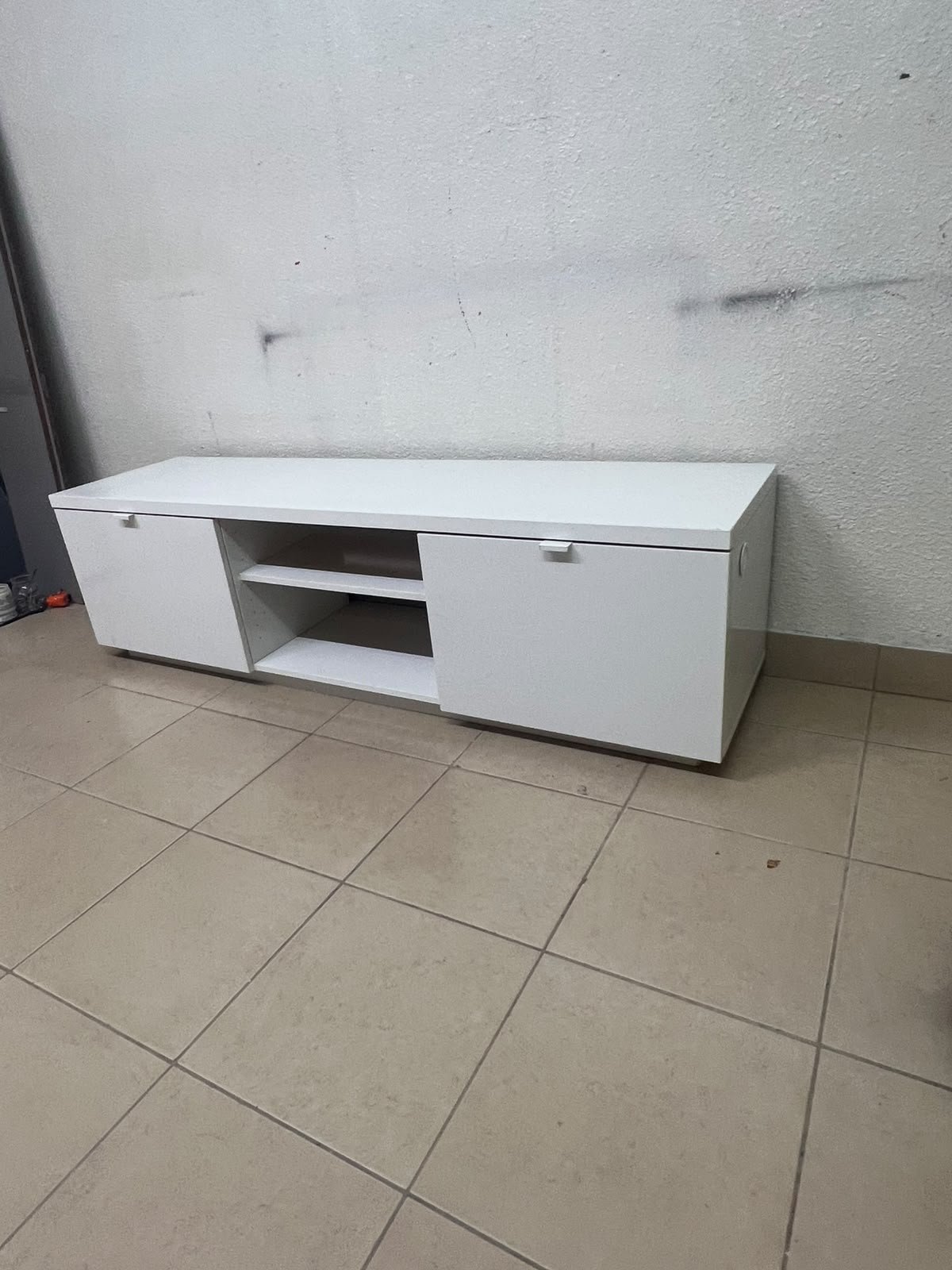 The IKEA BYÅS TV unit in high-gloss white features a sleek, modern design with two cabinets and open central shelves. - Image 11