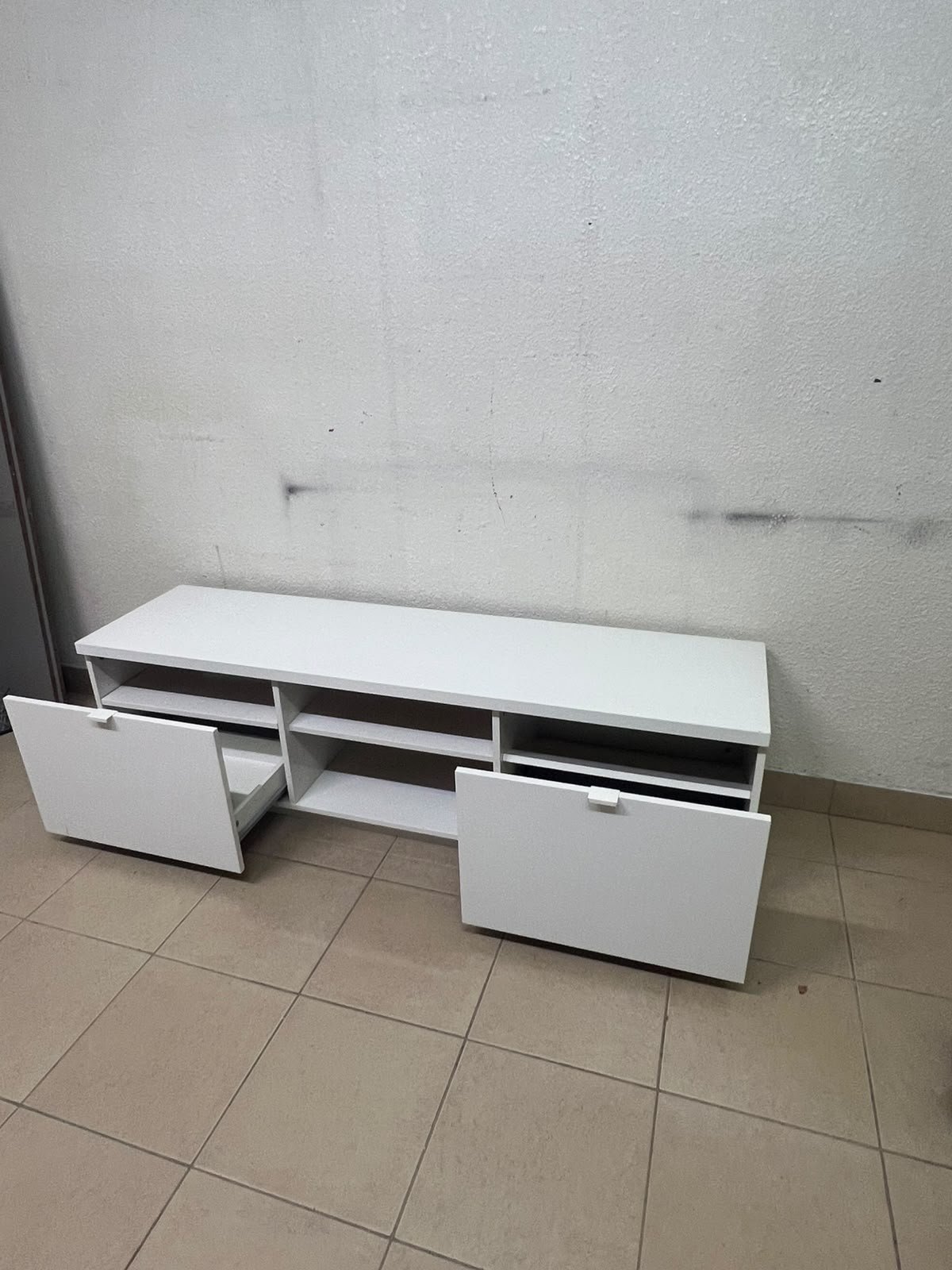 The IKEA BYÅS TV unit in high-gloss white features a sleek, modern design with two cabinets and open central shelves. - Image 12