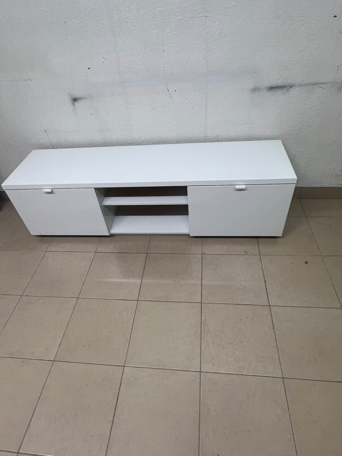 The IKEA BYÅS TV unit in high-gloss white features a sleek, modern design with two cabinets and open central shelves. - Image 4