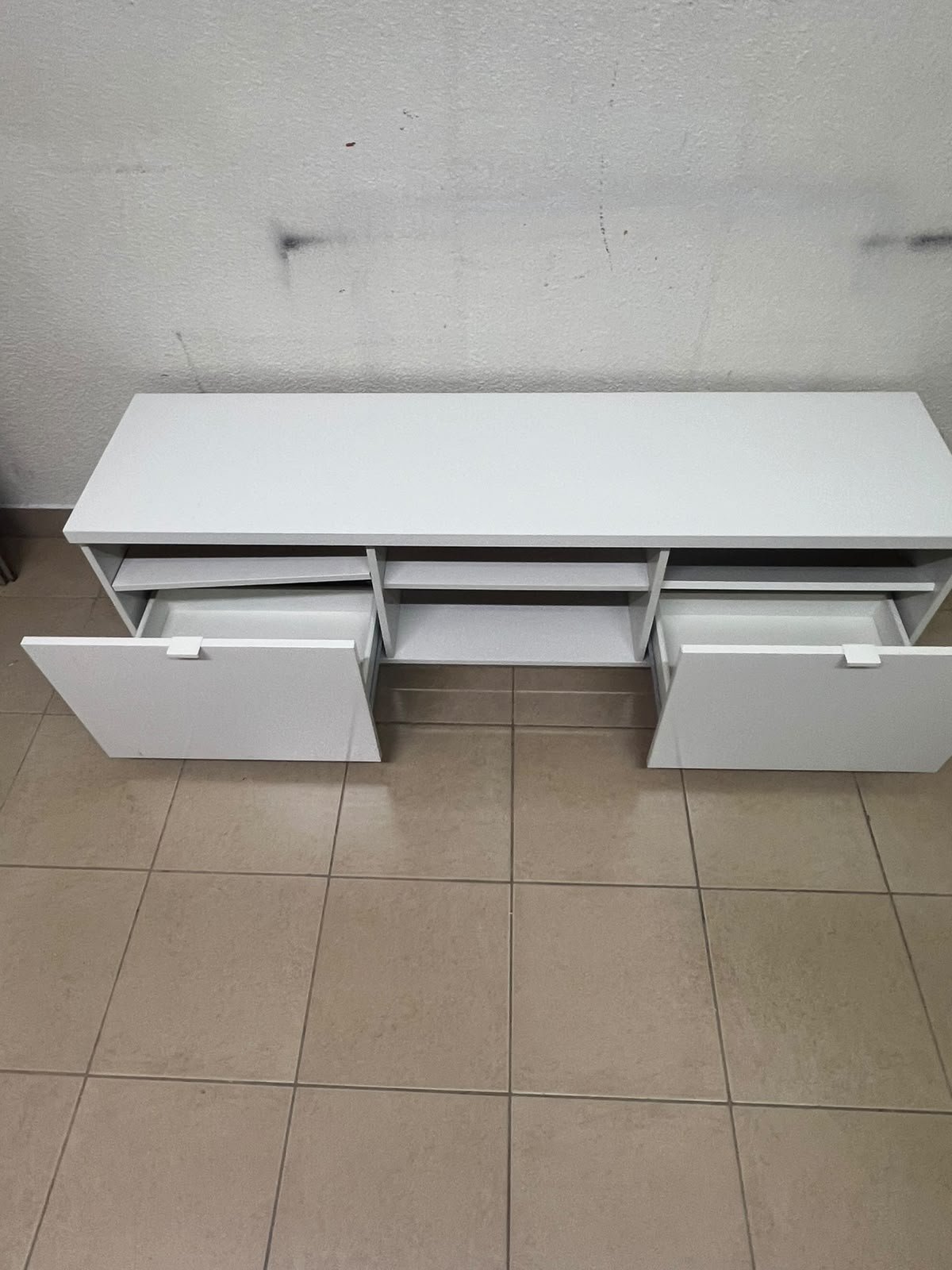 The IKEA BYÅS TV unit in high-gloss white features a sleek, modern design with two cabinets and open central shelves. - Image 5
