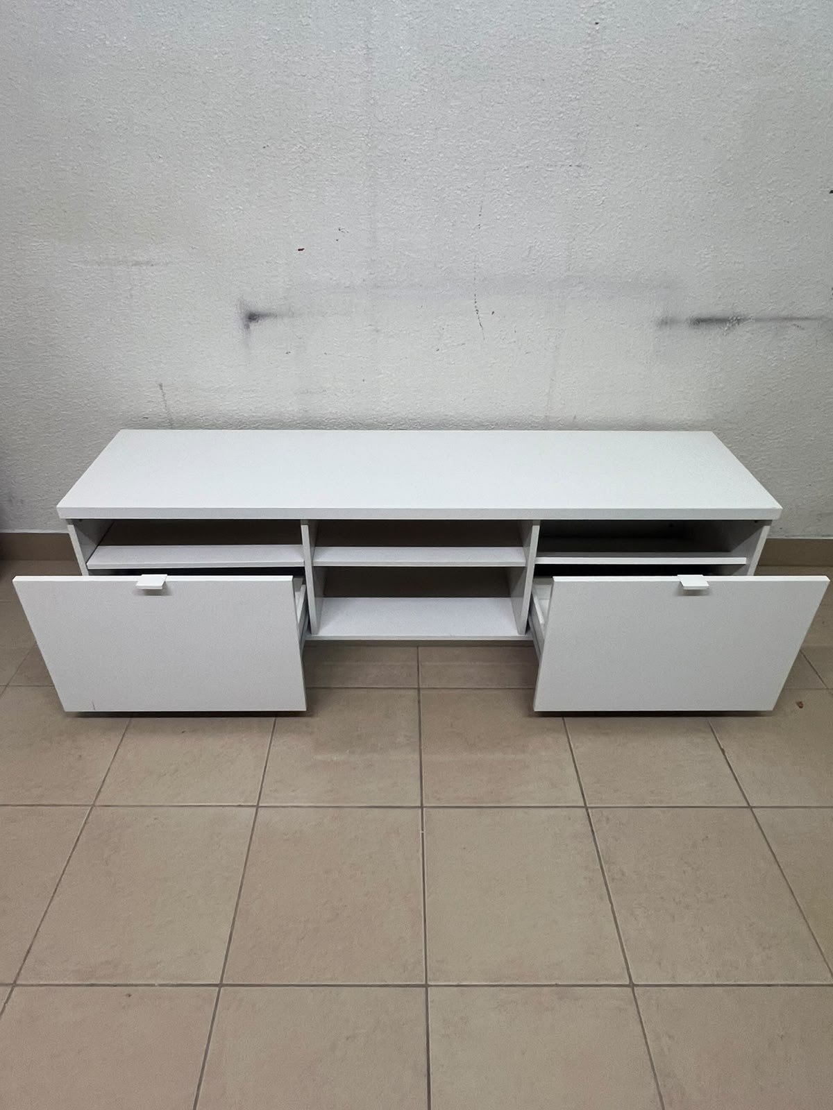 The IKEA BYÅS TV unit in high-gloss white features a sleek, modern design with two cabinets and open central shelves. - Image 6