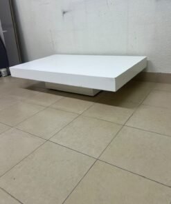 A modern, low, rectangular white coffee table featuring a minimalist design, a recessed base, and a smooth lacquered finish. - Image 3