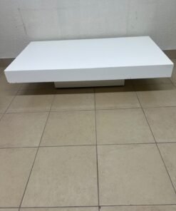 A modern, low, rectangular white coffee table featuring a minimalist design, a recessed base, and a smooth lacquered finish. - Image 5