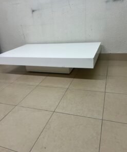 A modern, low, rectangular white coffee table featuring a minimalist design, a recessed base, and a smooth lacquered finish. - Image 7