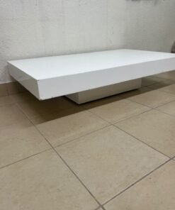 A modern, low, rectangular white coffee table featuring a minimalist design, a recessed base, and a smooth lacquered finish. - Image 8