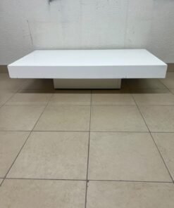 A modern, low, rectangular white coffee table featuring a minimalist design, a recessed base, and a smooth lacquered finish. - Image 9