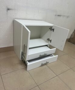 A white wooden storage cabinet featuring two upper doors and two lower drawers equipped with rectangular silver handles. - Image 3