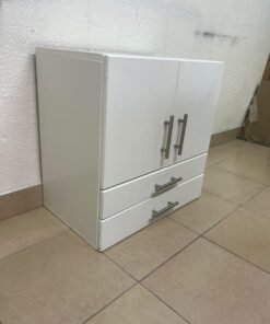 A white wooden storage cabinet featuring two upper doors and two lower drawers equipped with rectangular silver handles. - Image 2