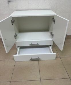 A white wooden storage cabinet featuring two upper doors and two lower drawers equipped with rectangular silver handles. - Image 8