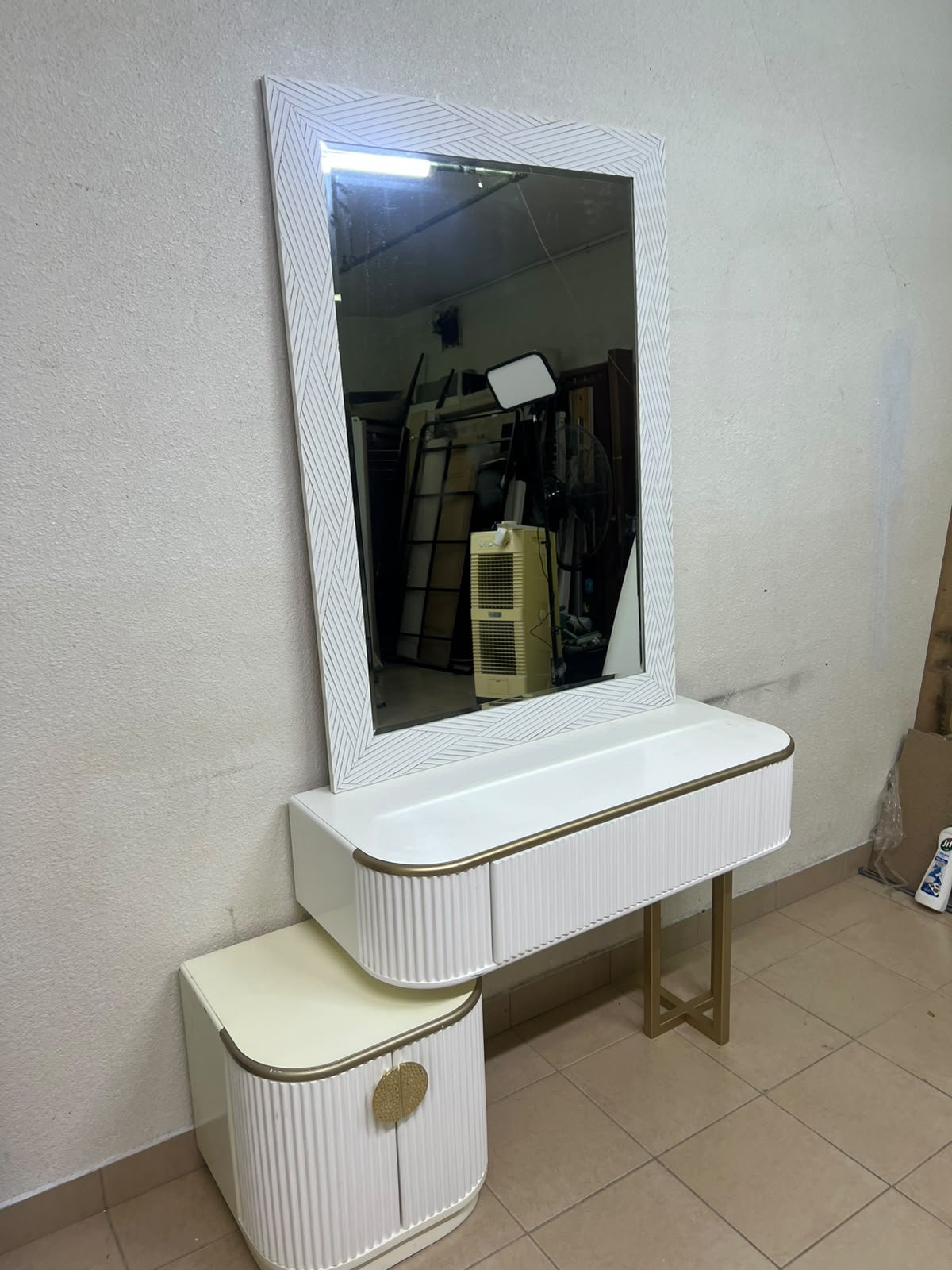 A modern vanity (makeup station) featuring a white striped design, a gold frame, and illuminated accents—a piece of contemporary bedroom décor. - Image 2