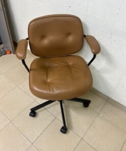 The ALEFJÄLL office chair from IKEA, crafted from golden-brown "Grann" leather and featuring distinctive tufted button detailing.