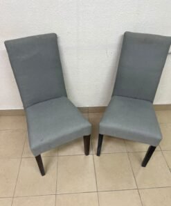 A modern "Parsons" style dining chair, featuring a high back, gray upholstery, and dark wood legs. - Image 3