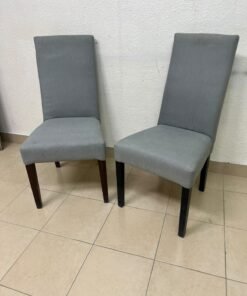 A modern "Parsons" style dining chair, featuring a high back, gray upholstery, and dark wood legs. - Image 5