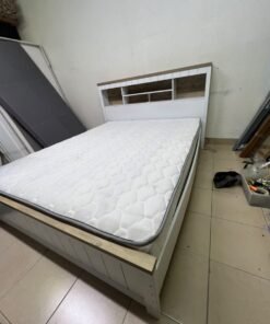 A white wooden King-size bed frame featuring an integrated headboard with shelves, accompanied by a matching padded mattress. - Image 3