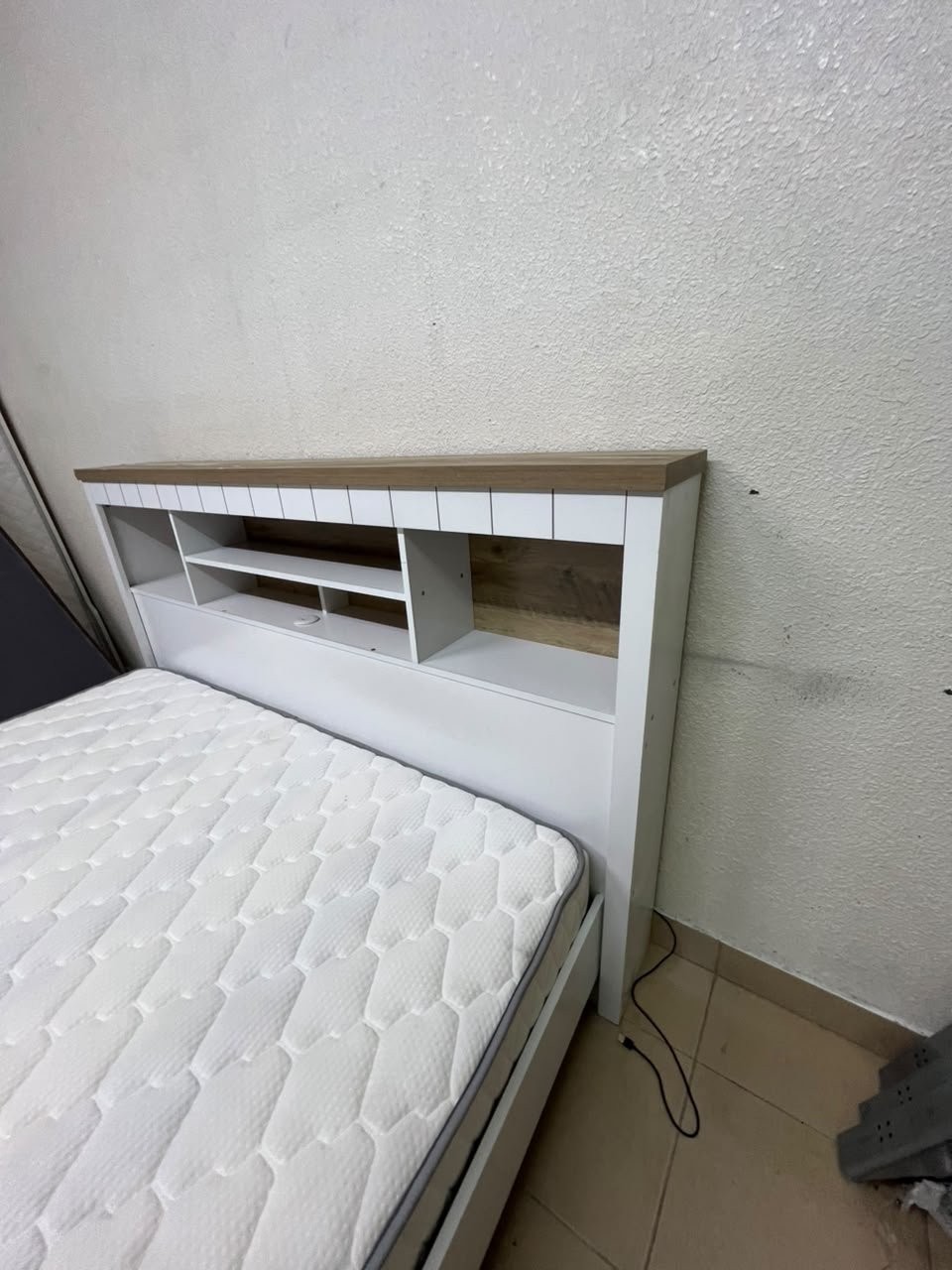 A white wooden King-size bed frame featuring an integrated headboard with shelves, accompanied by a matching padded mattress. - Image 5