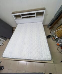 A white wooden King-size bed frame featuring an integrated headboard with shelves, accompanied by a matching padded mattress. - Image 2