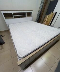 A white wooden King-size bed frame featuring an integrated headboard with shelves, accompanied by a matching padded mattress. - Image 6