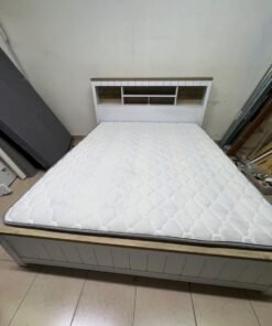 A white wooden King-size bed frame featuring an integrated headboard with shelves, accompanied by a matching padded mattress. - Image 8
