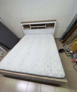 A white wooden King-size bed frame featuring an integrated headboard with shelves, accompanied by a matching padded mattress. - Image 9