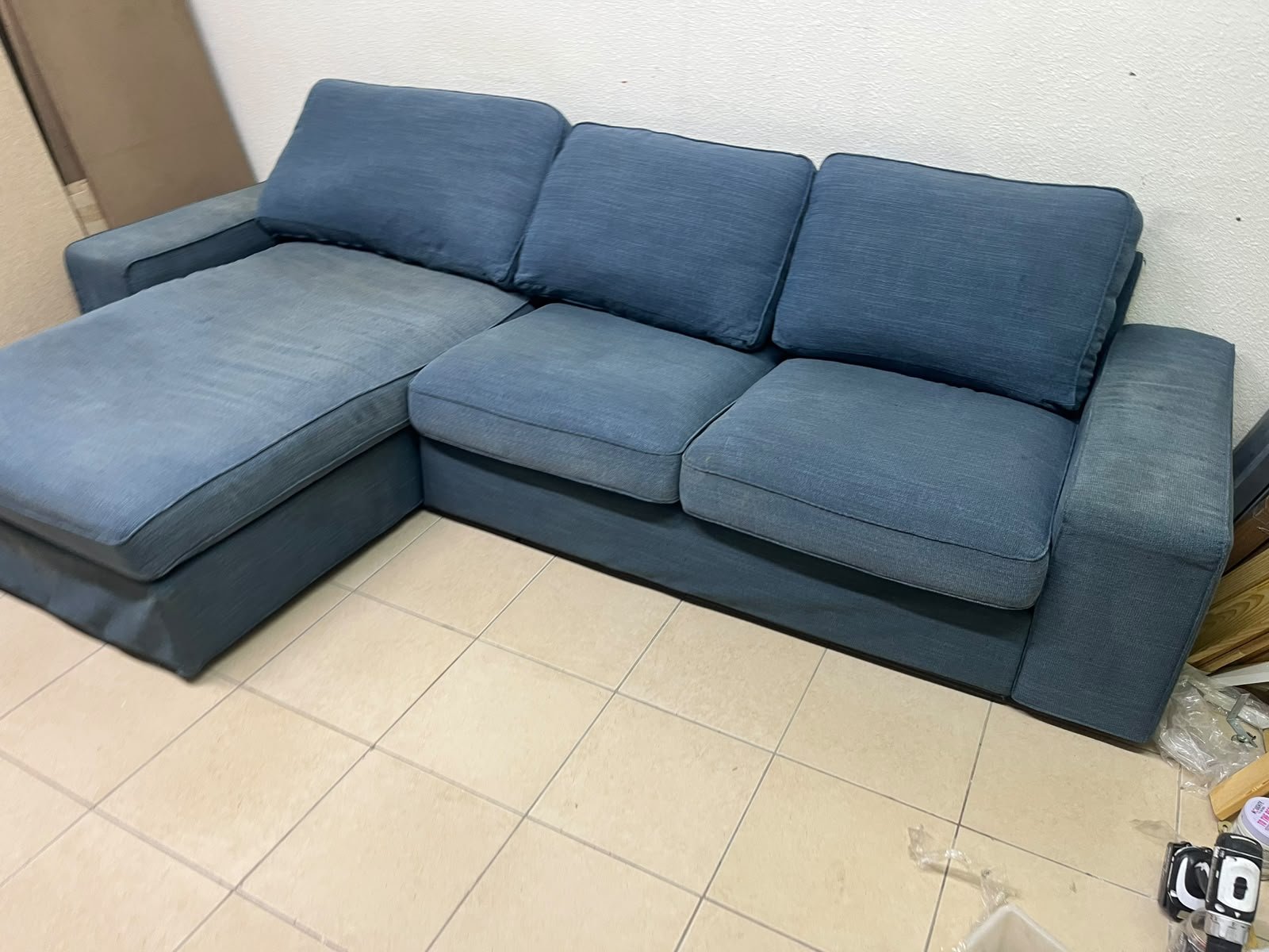 IKEA "KIVIK" sectional sofa, featuring a textured blue fabric.
