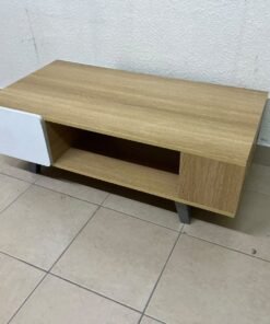 The Adonia coffee table by Danube Home is crafted from oak wood and features a rectangular top with a wood finish, accented by a distinctive white cabinet door. - Image 2