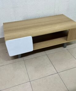 The Adonia coffee table by Danube Home is crafted from oak wood and features a rectangular top with a wood finish, accented by a distinctive white cabinet door. - Image 4