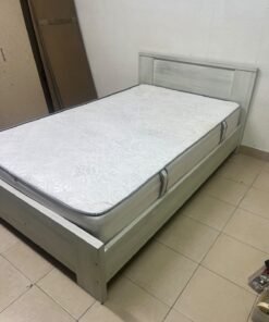 A double bed with a light wood finish, featuring a paneled headboard and a standard upholstered mattress. - Image 6