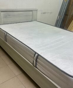 A double bed with a light wood finish, featuring a paneled headboard and a standard upholstered mattress. - Image 7