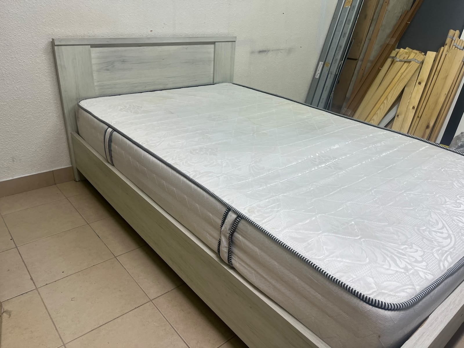 A double bed with a light wood finish, featuring a paneled headboard and a standard upholstered mattress. - Image 7