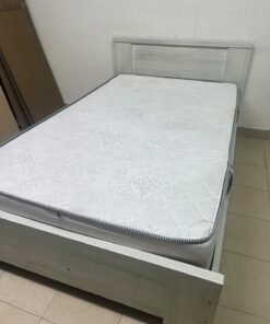 A double bed with a light wood finish, featuring a paneled headboard and a standard upholstered mattress. - Image 8
