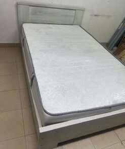 A double bed with a light wood finish, featuring a paneled headboard and a standard upholstered mattress. - Image 11