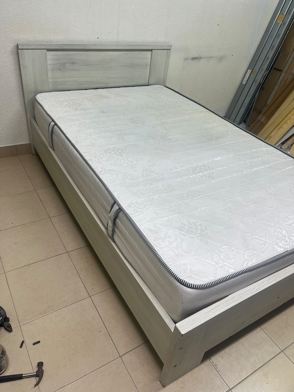A double bed with a light wood finish, featuring a paneled headboard and a standard upholstered mattress. - Image 3