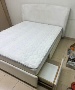 A modern, minimalist beige platform bed featuring a curved, upholstered headboard and a cushioned white mattress. - Image 3