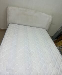 A modern, minimalist beige platform bed featuring a curved, upholstered headboard and a cushioned white mattress. - Image 4
