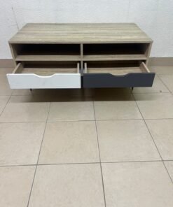 The "Maxton" coffee table from Home Center features a wood-effect finish, slender black hairpin legs, and two contrasting drawers. - Image 7