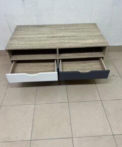 The "Maxton" coffee table from Home Center features a wood-effect finish, slender black hairpin legs, and two contrasting drawers. - Image 4